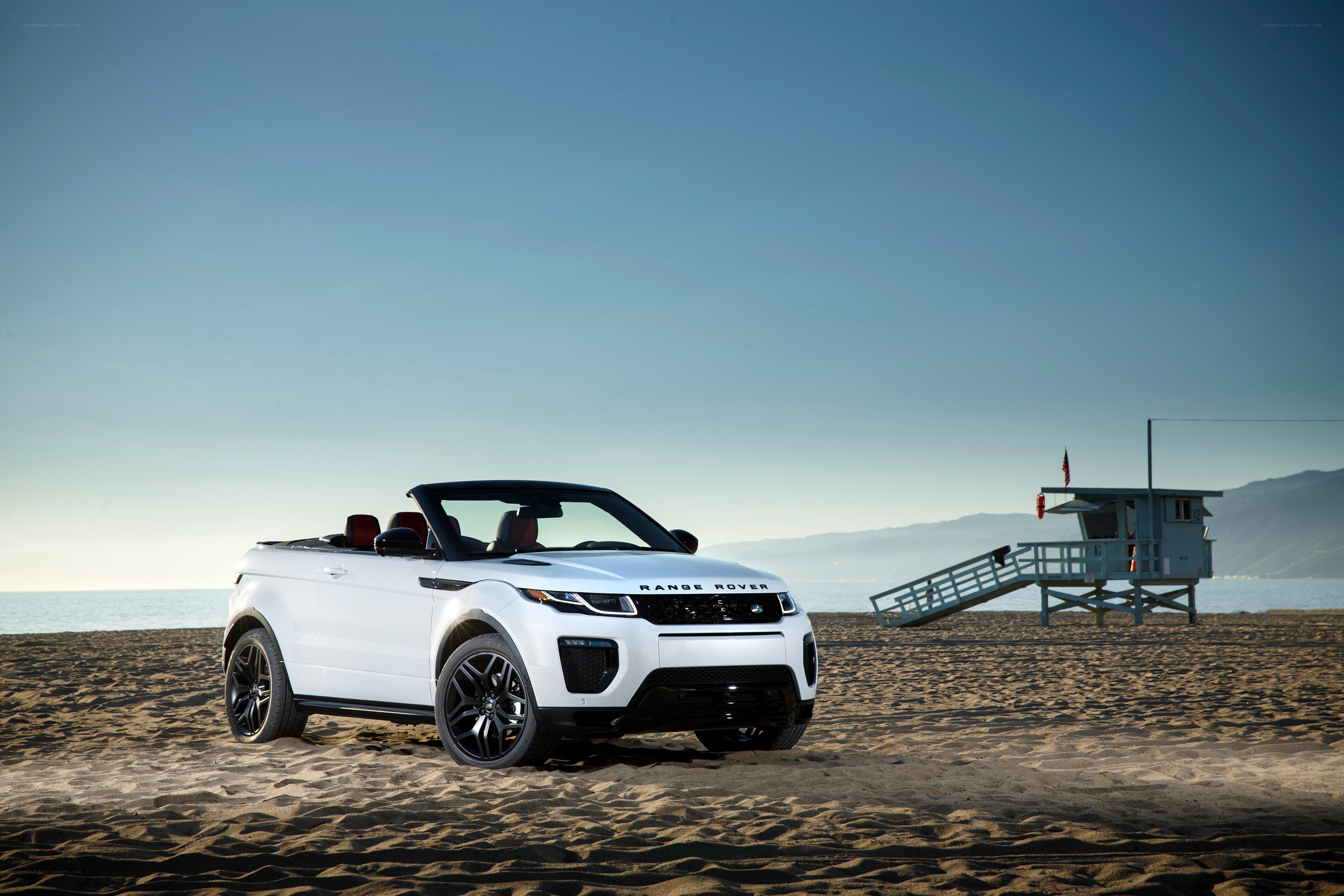 White Range Rover on beach