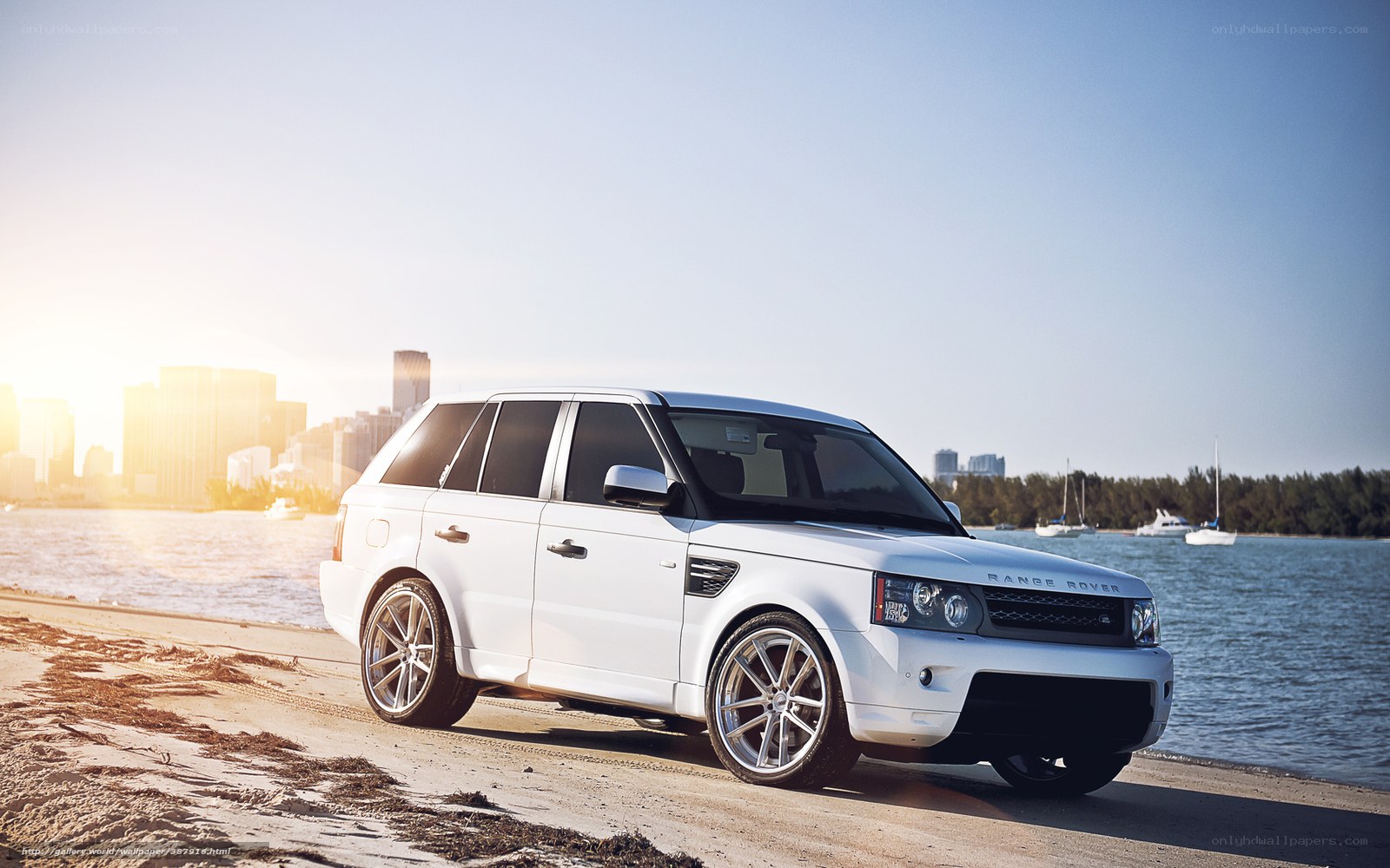 White Range Rover on beach