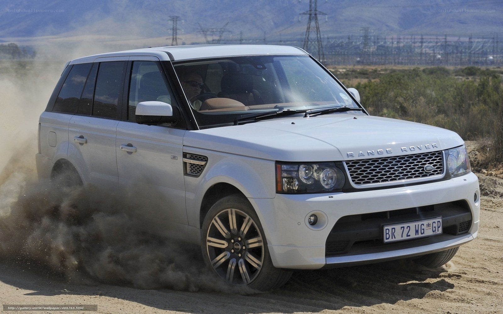 white range rover on dirt road