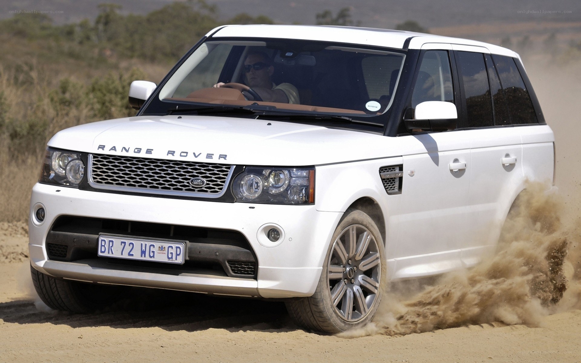 White Range Rover on dirt road