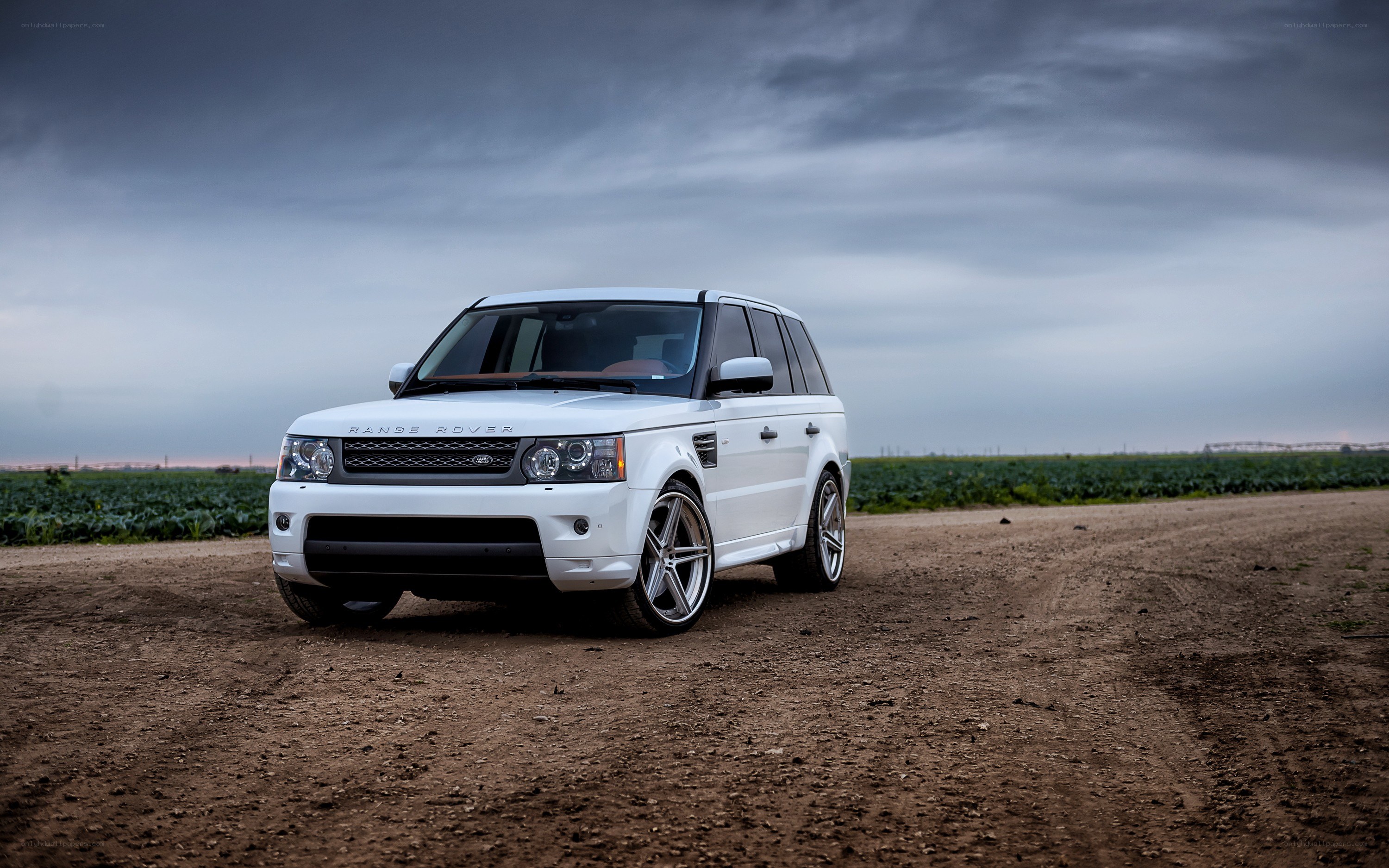 White Range Rover on dirt road