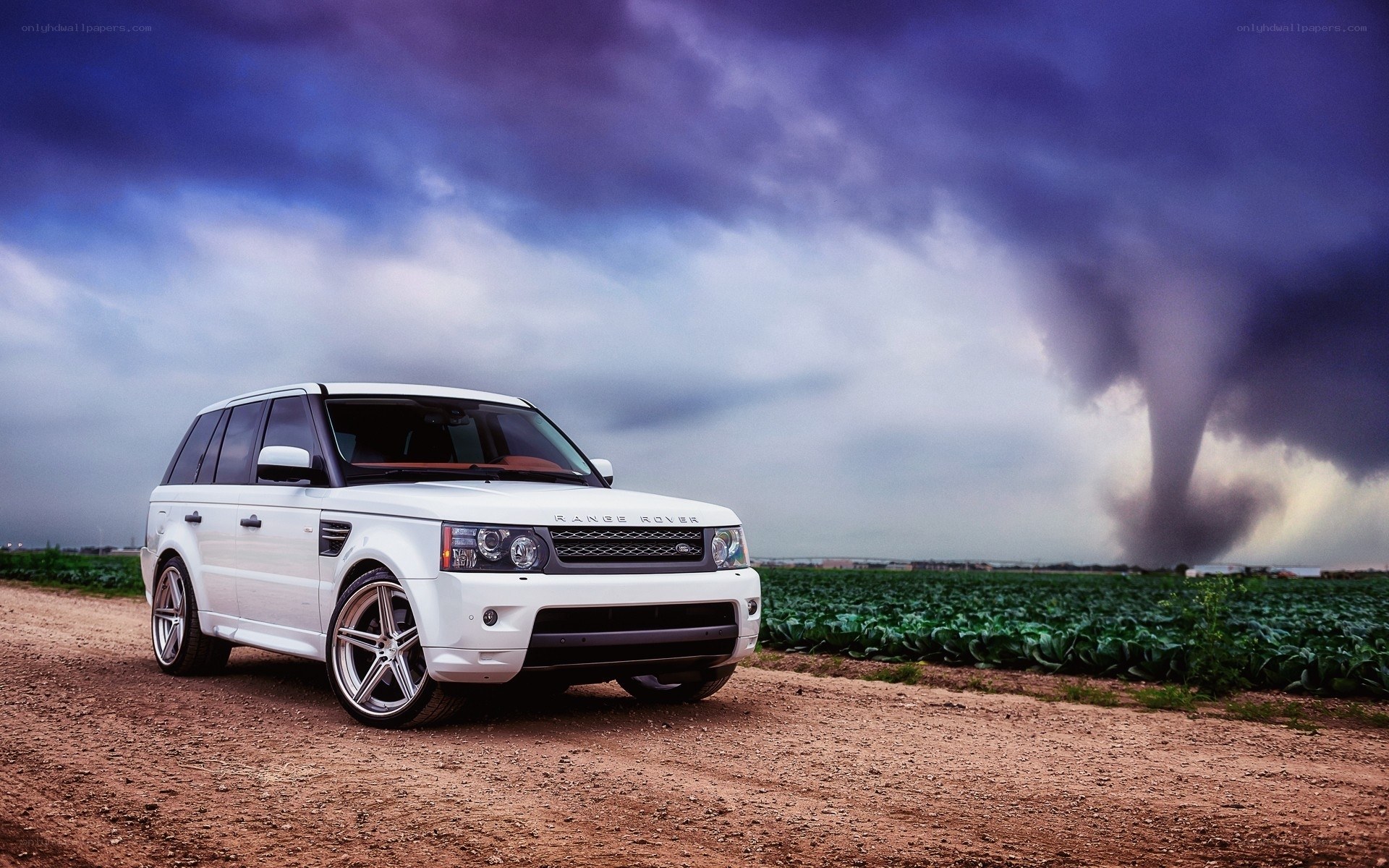 White Range Rover on dirt road