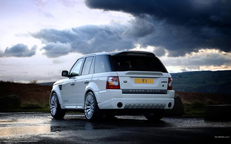 White Range Rover on wet road