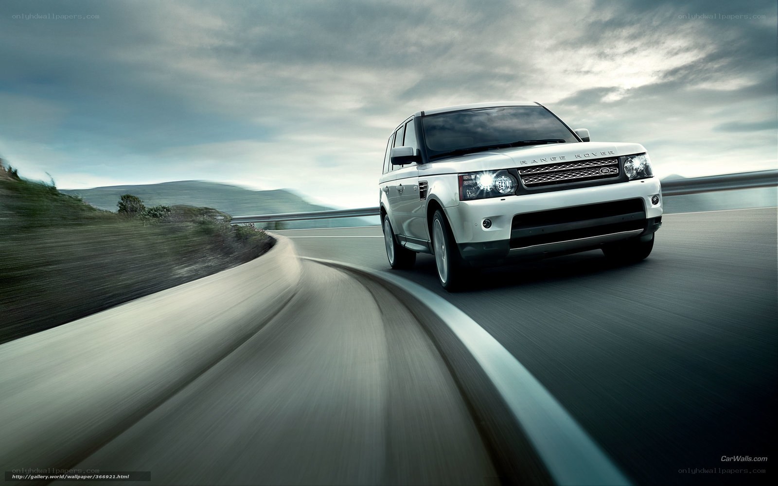 White Range Rover on winding road