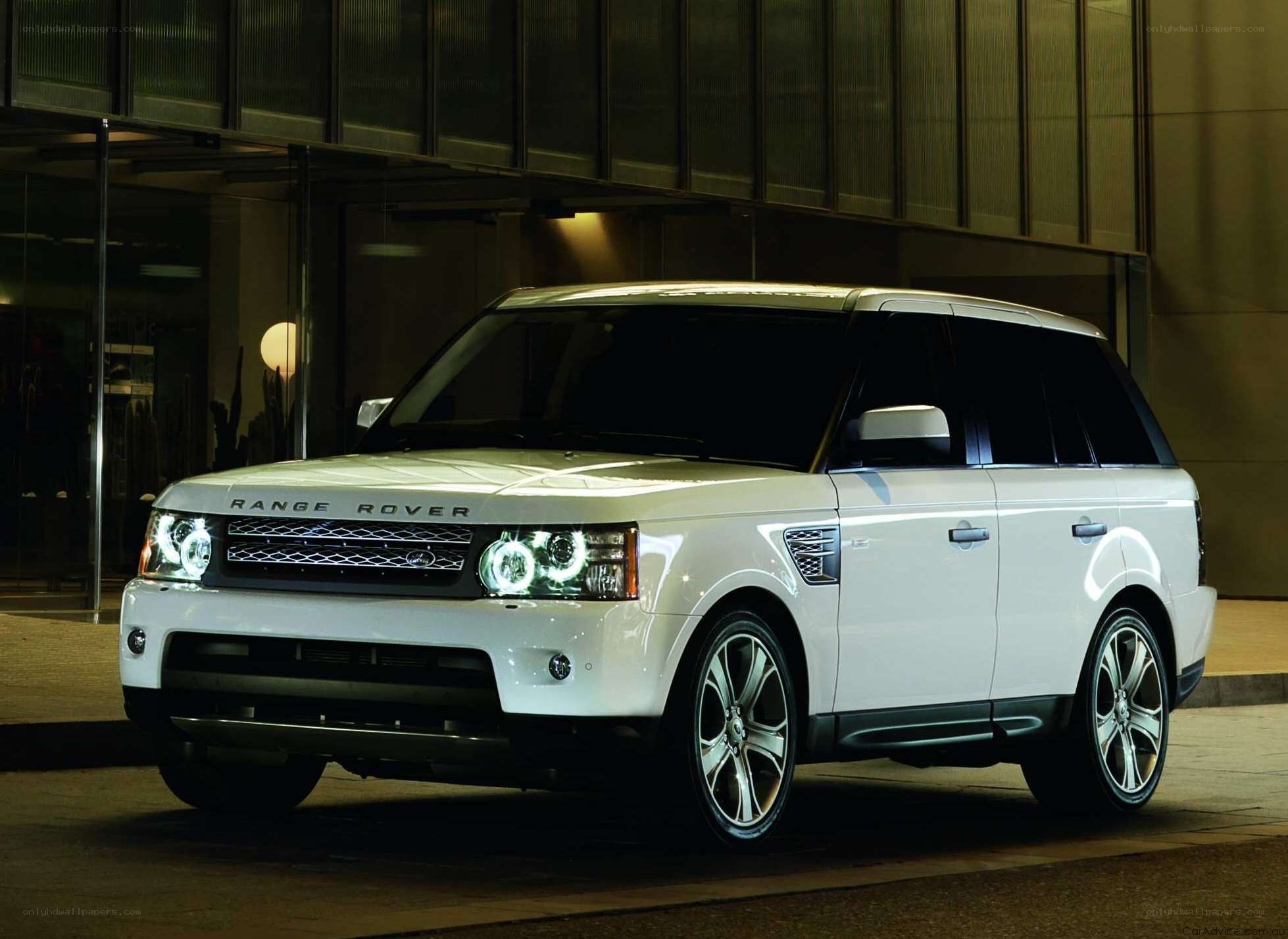 White Range Rover parked at night