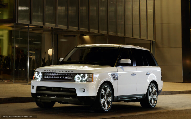 White Range Rover parked at night