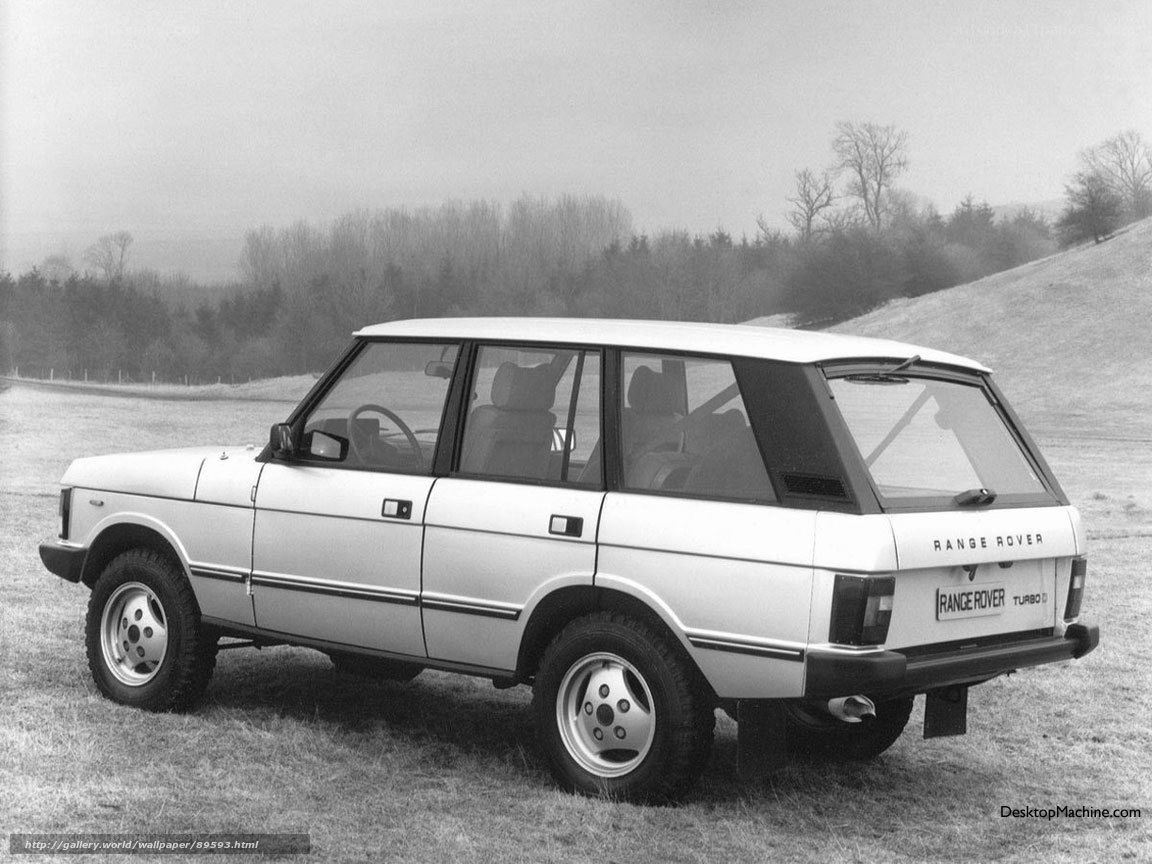 White Range Rover parked in field