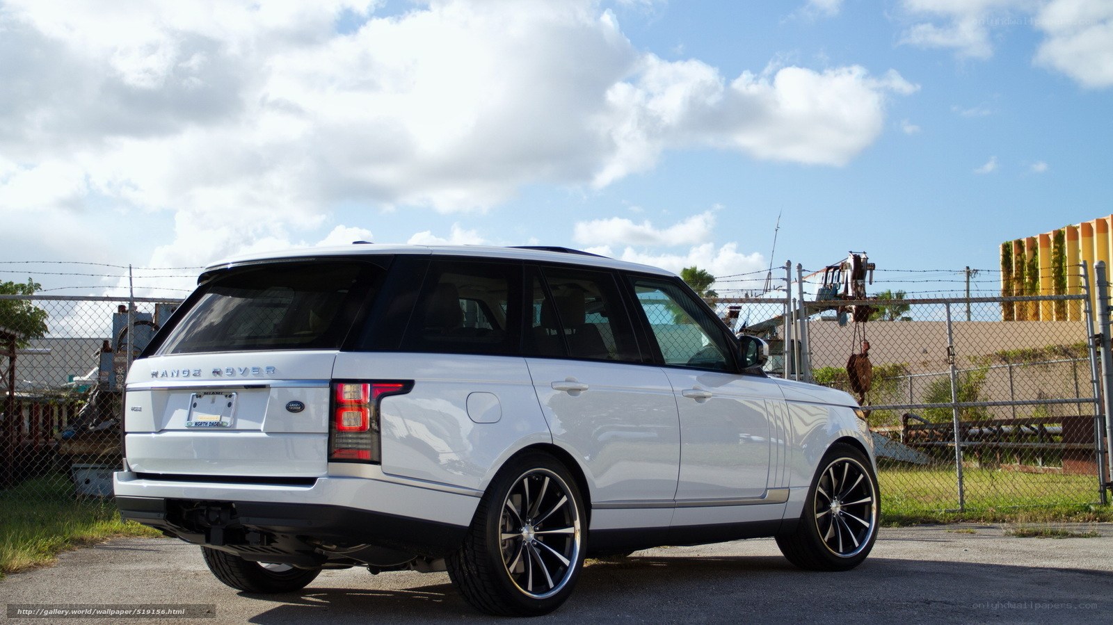 White Range Rover parked outside