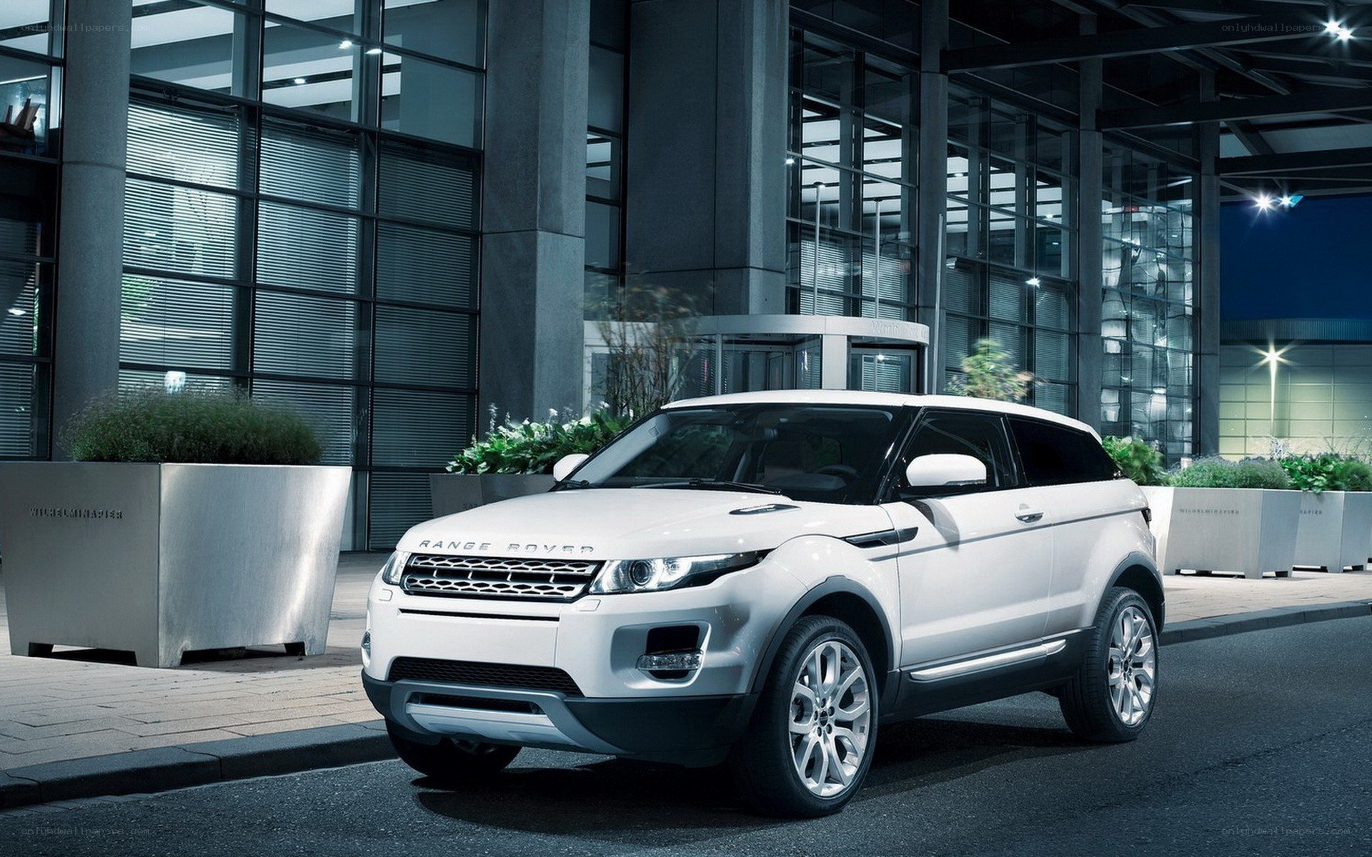 White Range Rover parked outside
