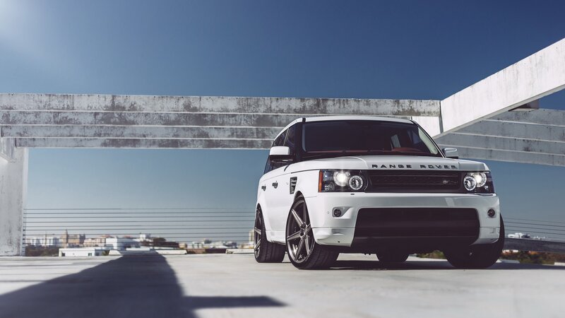 White Range Rover Suv — Dramatic, Afternoon, Photograph, Concrete Structure, Cityscape, Sky, Blue