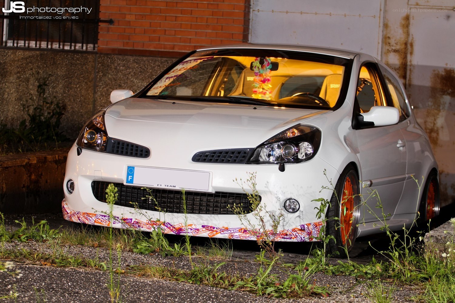 White Renault Clio with custom wheels