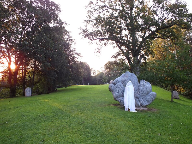 White-robed Figure in Garden — Green