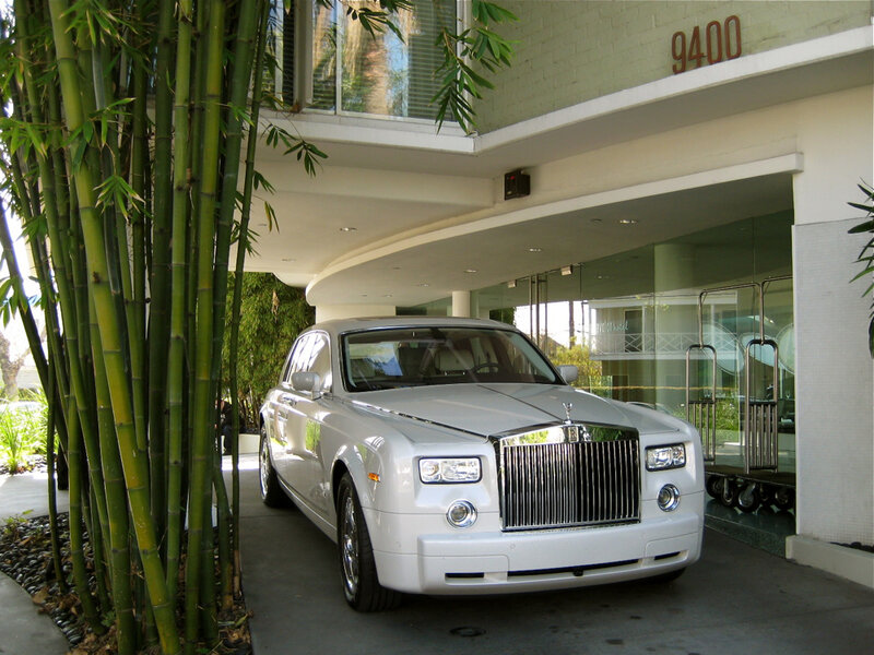 White Rolls-Royce at hotel entrance