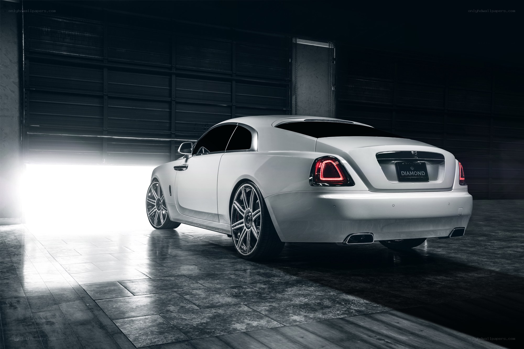White Rolls-Royce in garage