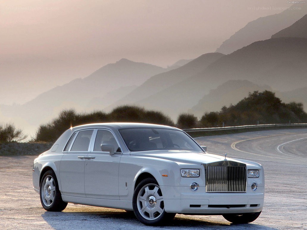 White Rolls-Royce on a mountain road