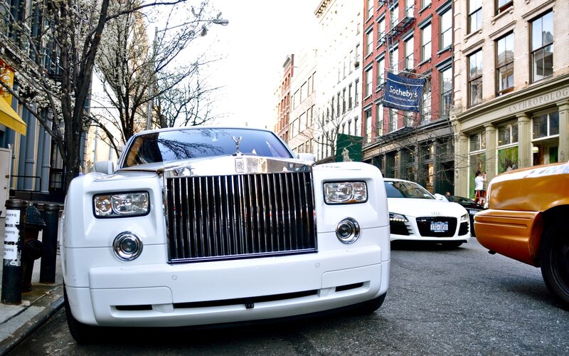 White Rolls-Royce on city street