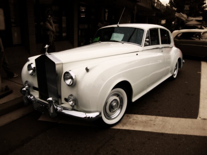 White Rolls-Royce on city street