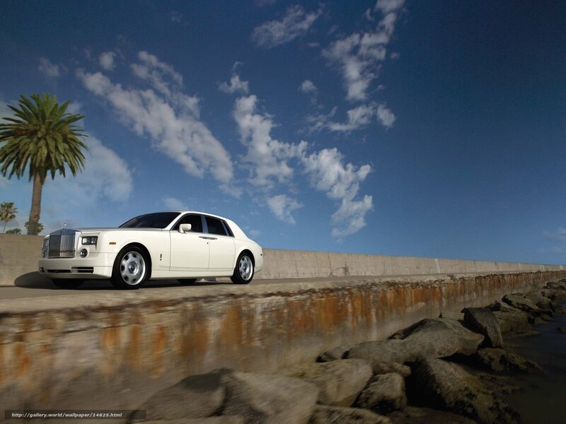 White Rolls-Royce on coastal road