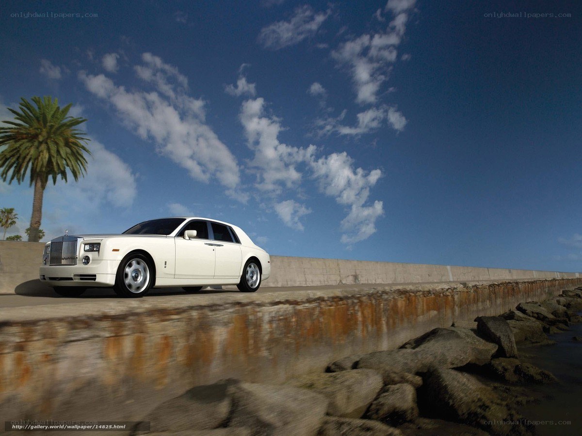 White Rolls-Royce on coastal road