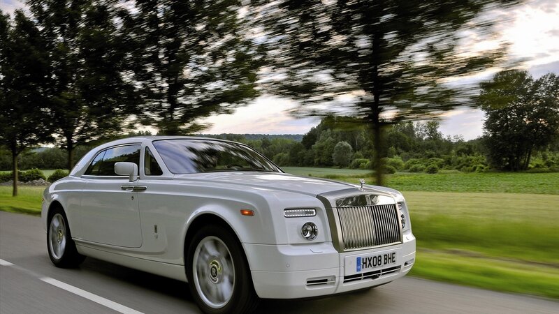 White Rolls-Royce on country road