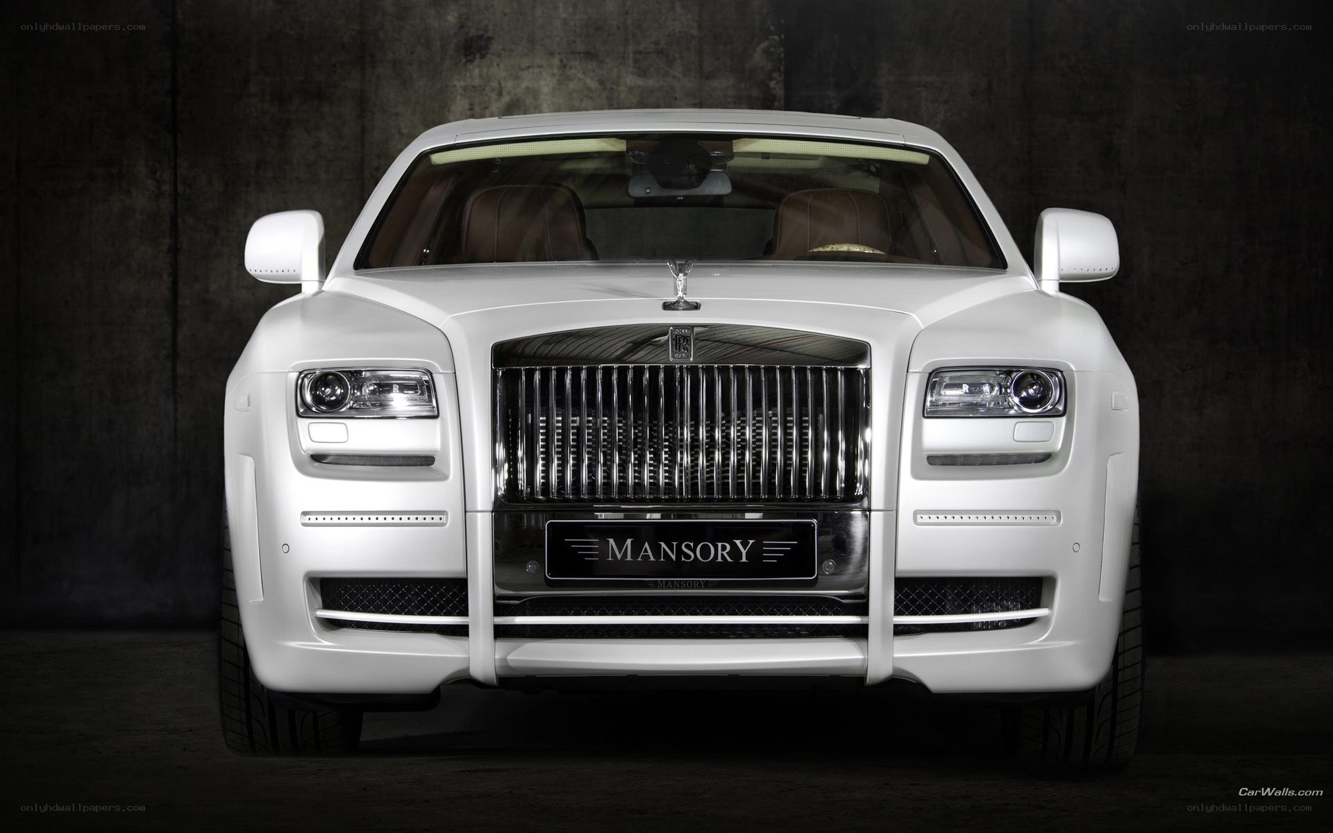 white rolls-royce with mansory badge