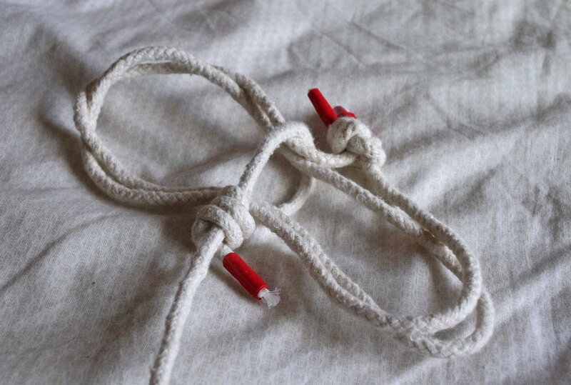 white rope with red tips