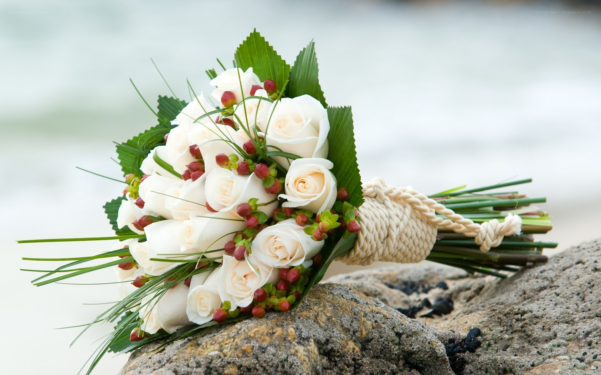 White rose bouquet on rock