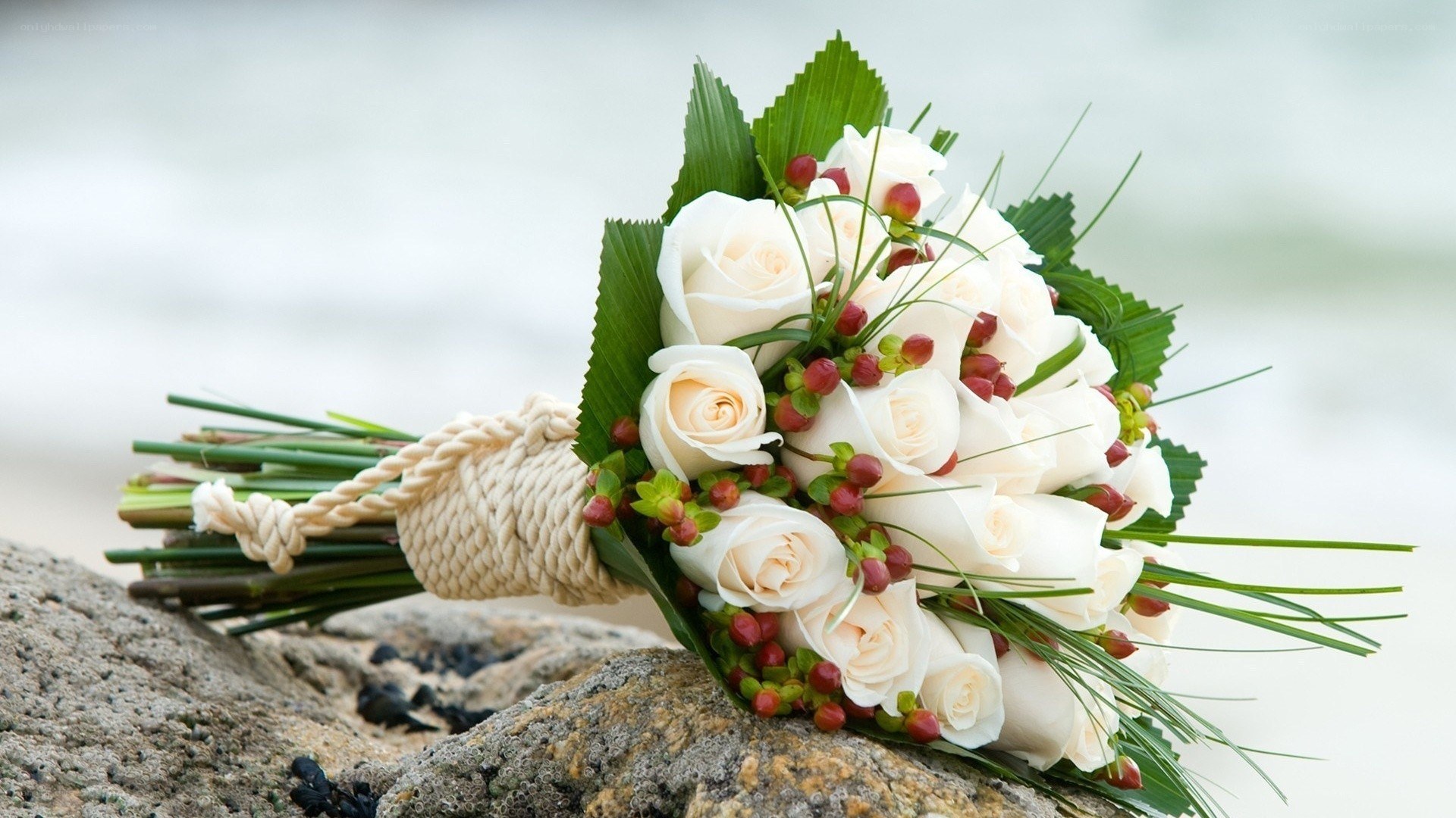 White rose bouquet on rocks