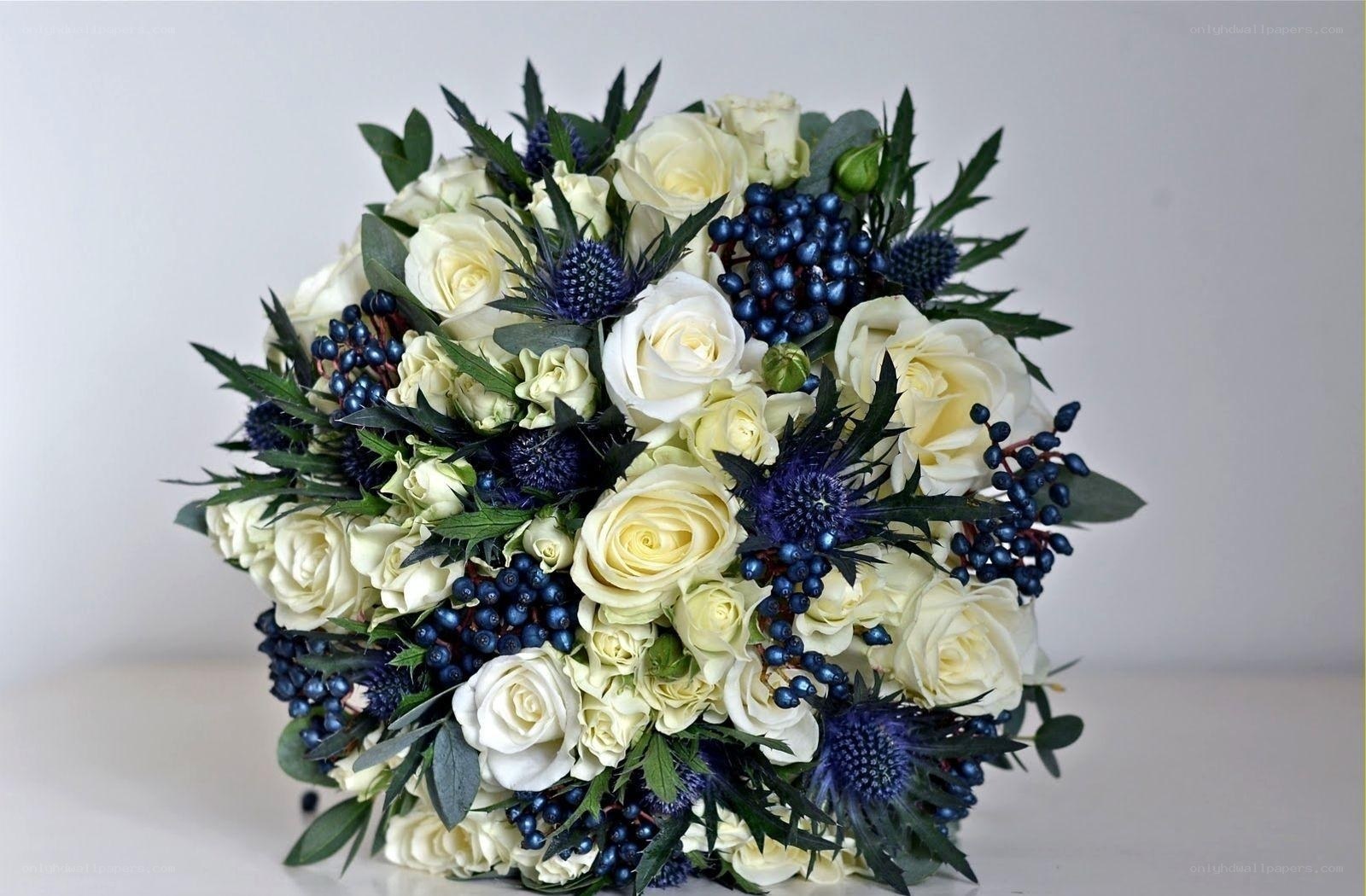 white roses and blue thistles bouquet