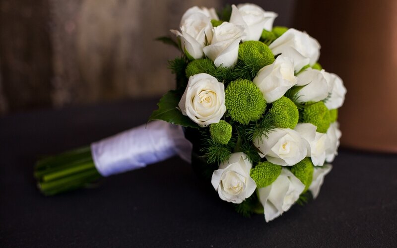 White roses and green flowers bouquet