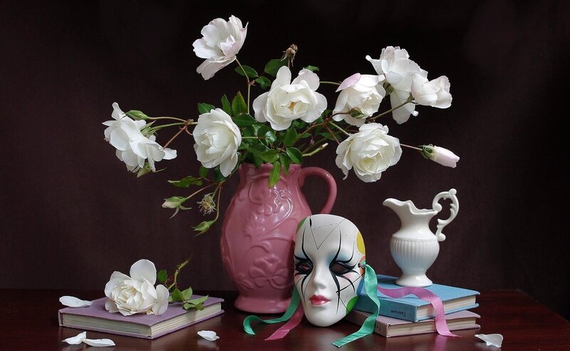 White roses and mask still life
