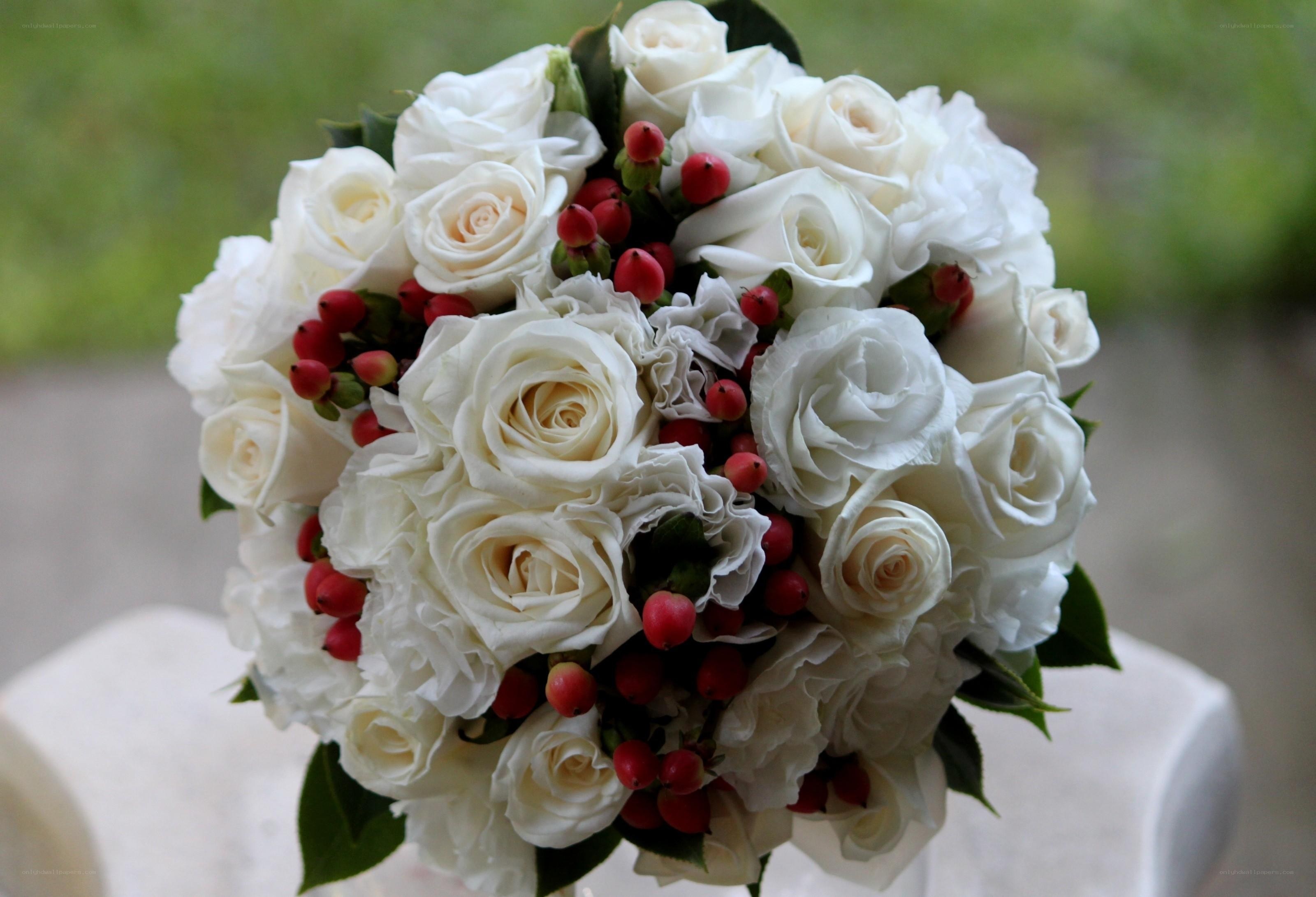 white roses and red berries bouquet