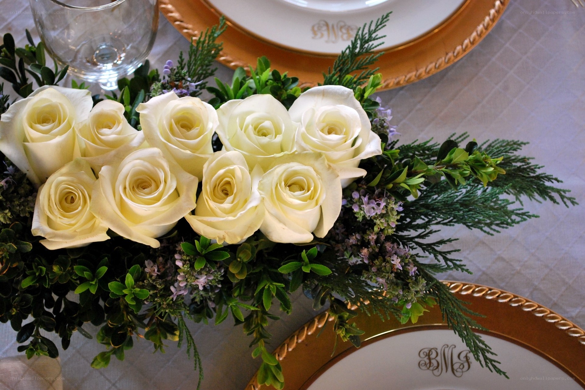 White roses on table setting