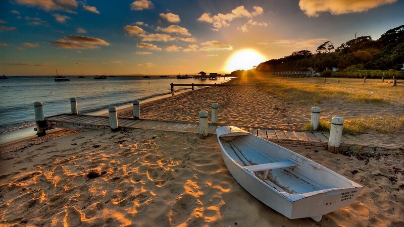 White Rowboat on Beach — Orange
