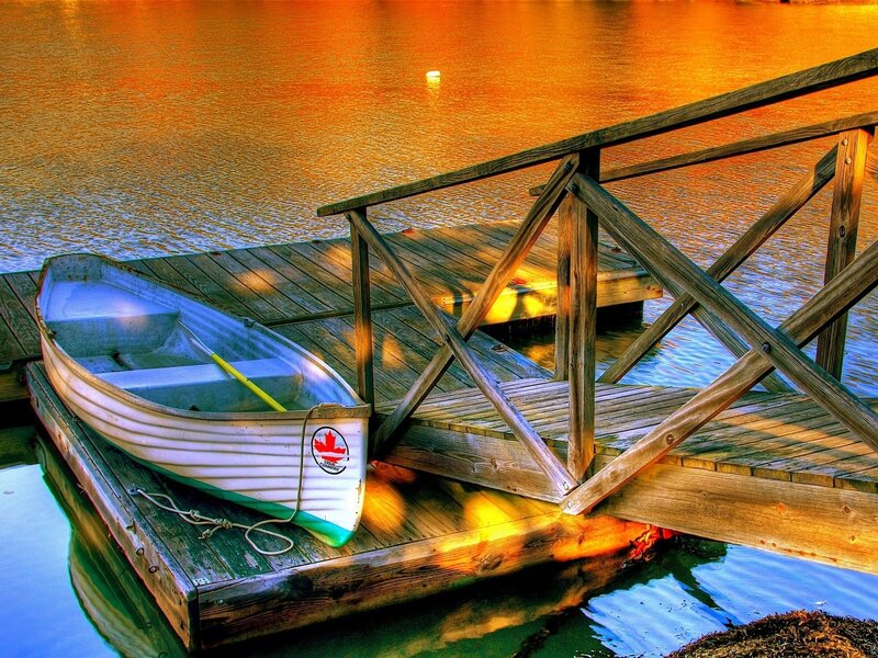 White Rowboat on Dock — Orange, Serene