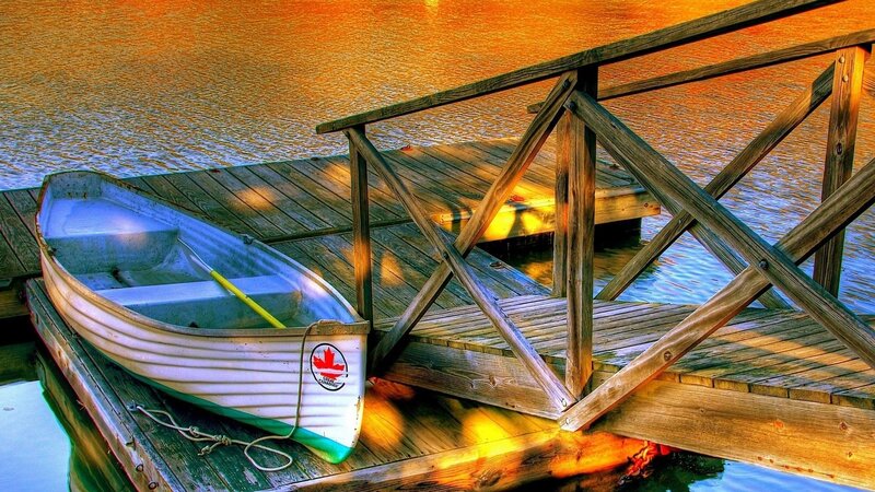 White Rowboat on Dock — Orange