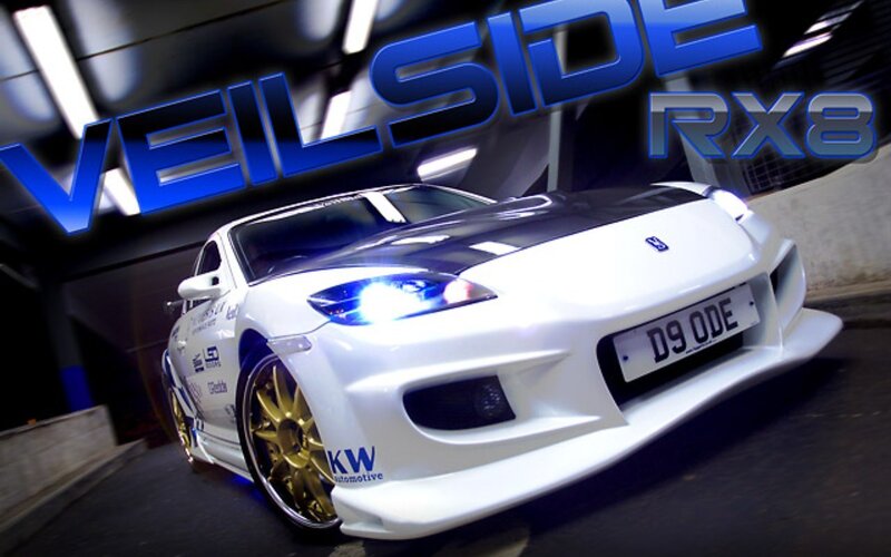 white rx8 with gold wheels