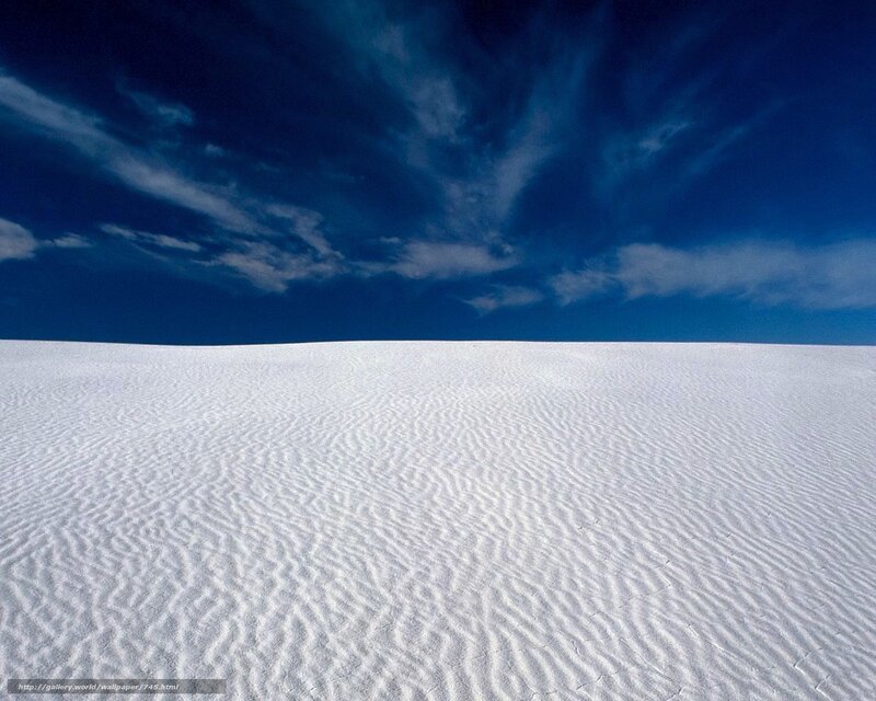 White sand dunes under blue sky