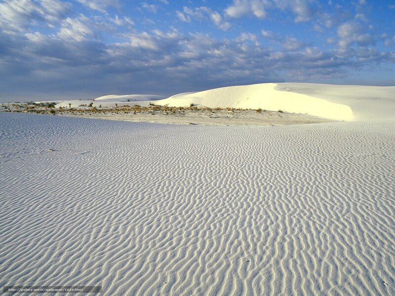 White sand dunes under blue sky