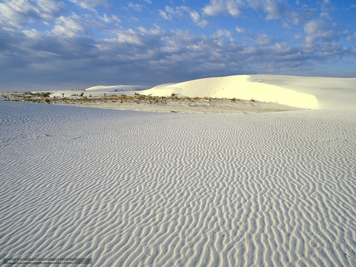White sand dunes under blue sky