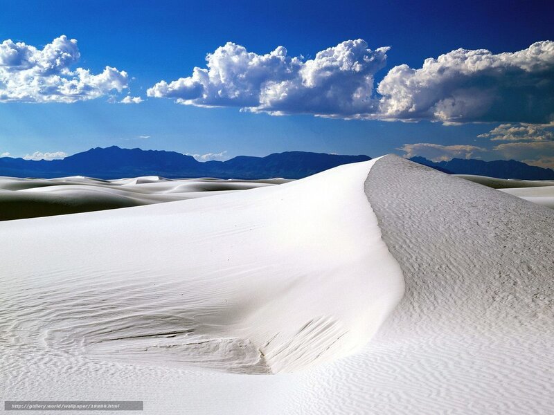 White sand dunes under blue sky
