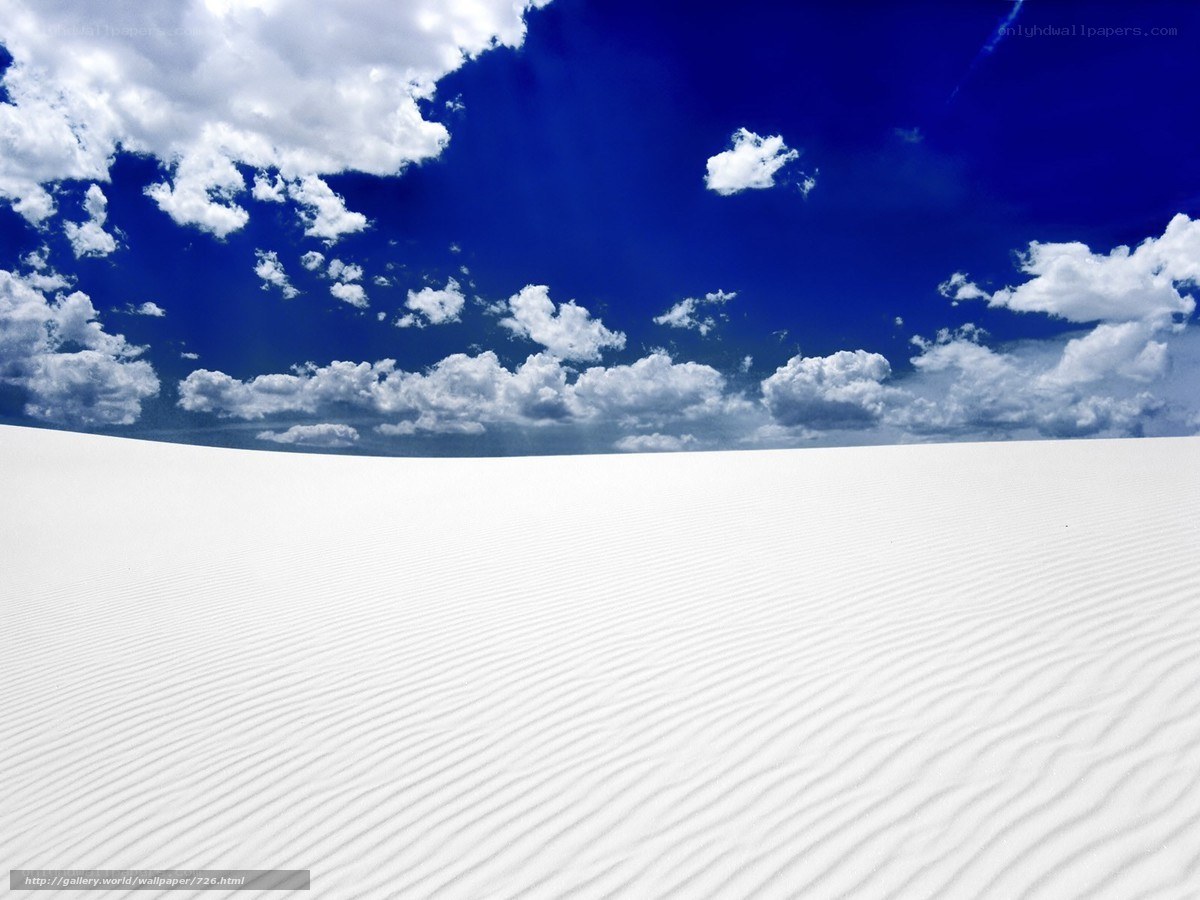 White sand dunes under blue sky
