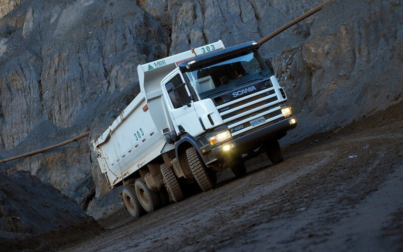 White Scania dump truck on a slope