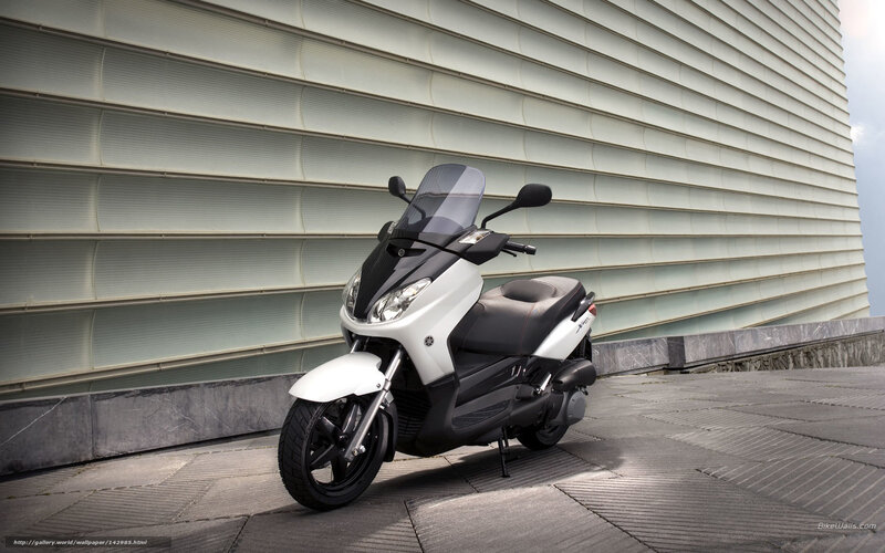 White scooter on city street