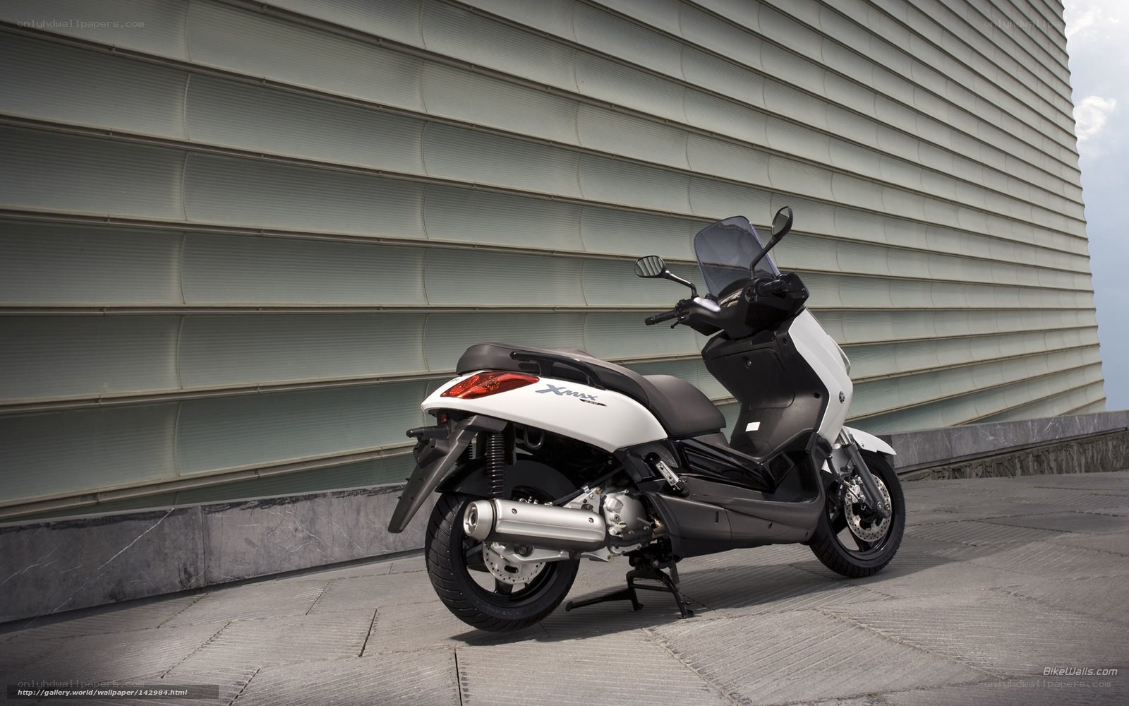 White scooter parked outside