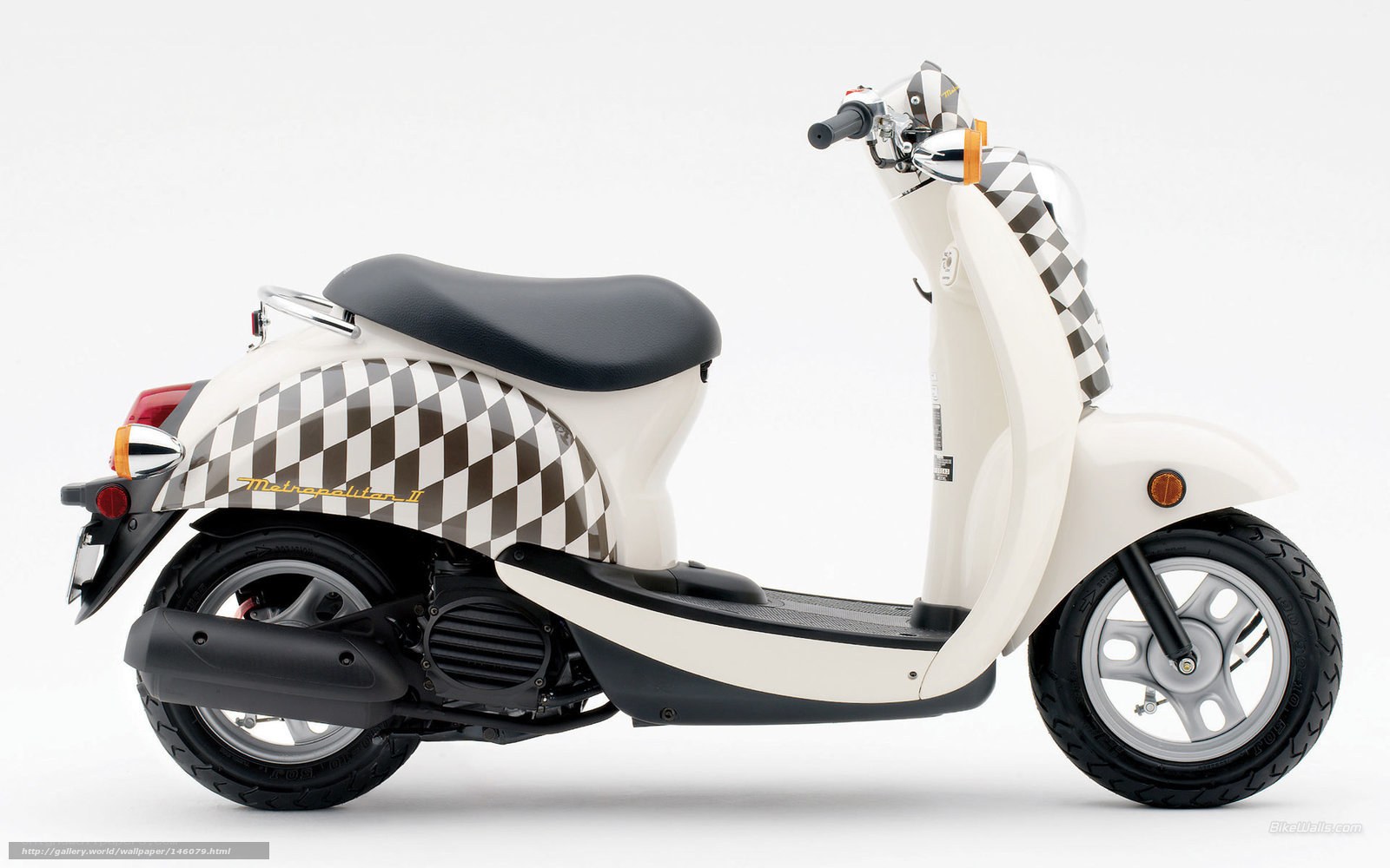 white scooter with checkered pattern
