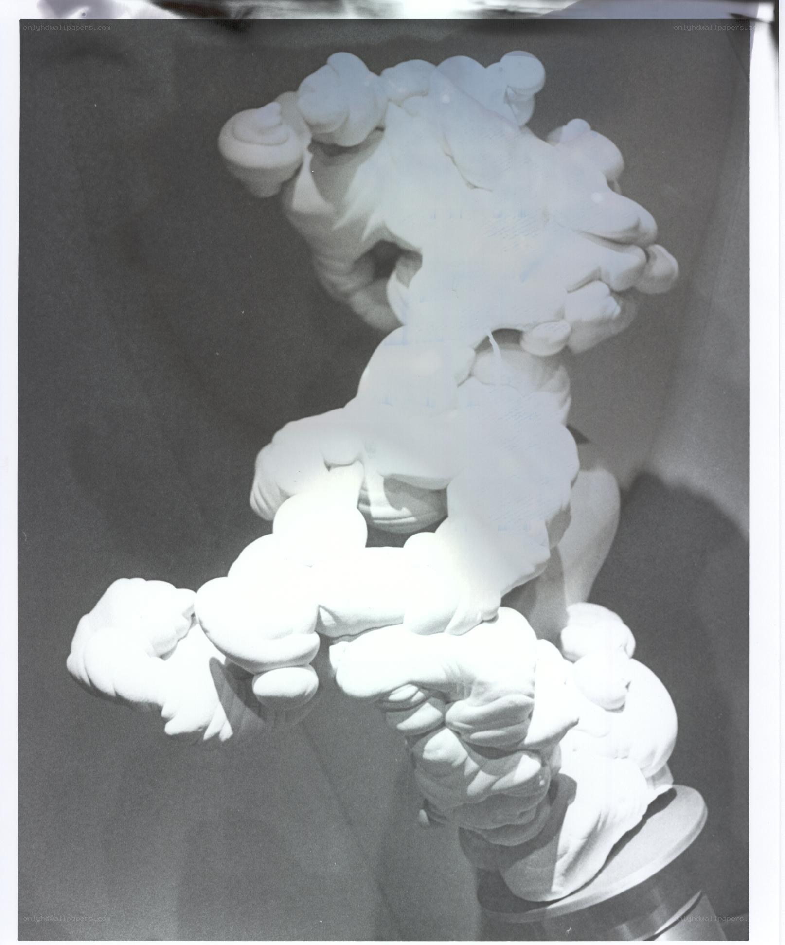 White sculptural form on stand