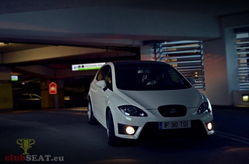 White SEAT car in parking garage