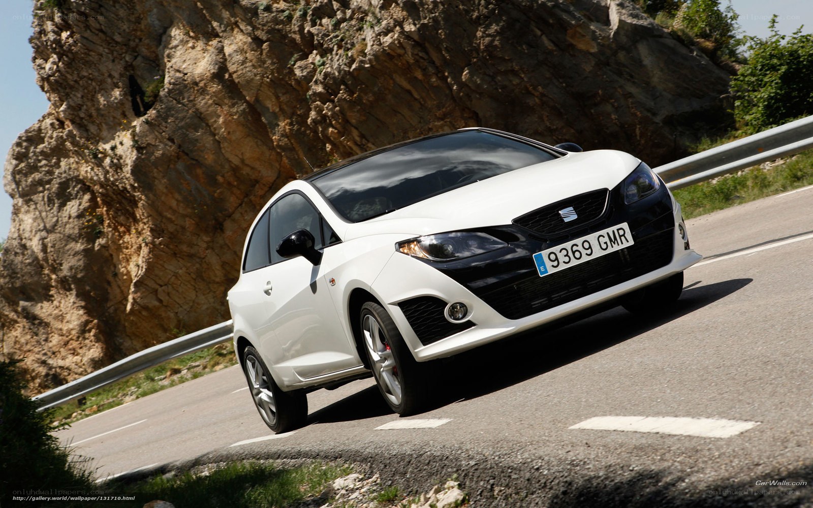white seat car on mountain road
