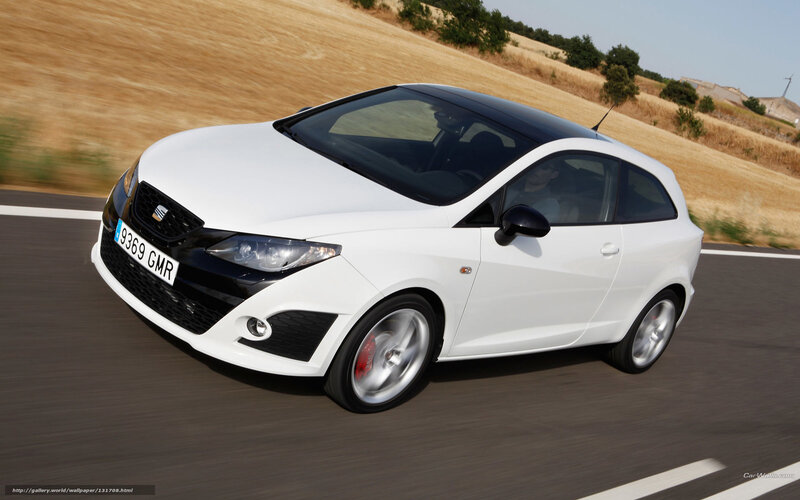 white seat hatchback in motion